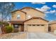 Two-story home featuring a well-manicured yard, covered porch, and a two car garage at 32 W Desert Vista Trl, San Tan Valley, AZ 85143