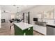 Open kitchen view with an island, stainless steel sink, and easy access to the living area at 32 W Desert Vista Trl, San Tan Valley, AZ 85143