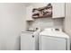 Laundry room featuring a white washer and dryer, and shelves at 32 W Desert Vista Trl, San Tan Valley, AZ 85143