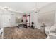 Bright living room with wood floors, a weight rack, and a chandelier at 32 W Desert Vista Trl, San Tan Valley, AZ 85143