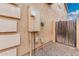 Side yard with a gate and access to utilities for home maintenance at 32 W Desert Vista Trl, San Tan Valley, AZ 85143