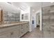 A double sink vanity, decorative lighting, and walk-in shower can be seen in this lovely bathroom at 33575 N Dove Lakes Dr # 1038, Cave Creek, AZ 85331