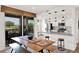 Bright dining area with access to the patio, showcasing modern pendant lighting at 33575 N Dove Lakes Dr # 1038, Cave Creek, AZ 85331