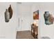 Warm entryway with decorative accents, rustic console table and a view of the front door at 33575 N Dove Lakes Dr # 1038, Cave Creek, AZ 85331