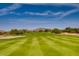 Expansive golf course view with meticulously striped fairways under a vibrant sky at 33575 N Dove Lakes Dr # 1038, Cave Creek, AZ 85331