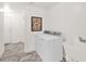 This laundry room features a utility sink and adjacent hallway at 33575 N Dove Lakes Dr # 1038, Cave Creek, AZ 85331