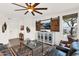 Stylish living room featuring a ceiling fan, sliding barn door entertainment center and modern furnishings at 33575 N Dove Lakes Dr # 1038, Cave Creek, AZ 85331