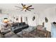 Inviting living room featuring a ceiling fan and stylish southwestern-patterned rug at 33575 N Dove Lakes Dr # 1038, Cave Creek, AZ 85331