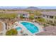 Beautiful community pool with lounge chairs, umbrellas and lush landscaping at 33575 N Dove Lakes Dr # 1038, Cave Creek, AZ 85331