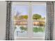 A beautiful water view can be seen through these curtain framed windows at 33575 N Dove Lakes Dr # 1038, Cave Creek, AZ 85331