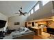 Inviting living room showcasing a vaulted ceiling, ceiling fan, and open floor plan with connection to the kitchen at 3535 W Monte Cristo Ave # 129, Phoenix, AZ 85053