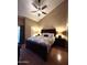 Spacious main bedroom with a ceiling fan, bedside lamps, and a king-size bed at 3535 W Monte Cristo Ave # 129, Phoenix, AZ 85053