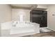 A soaking tub and glass enclosed shower with neutral tile and a tiled shower pan at 3603 E Indigo Bay Ct, Gilbert, AZ 85234