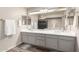 A bathroom with a double sink vanity and a large mirror above the sink at 3603 E Indigo Bay Ct, Gilbert, AZ 85234