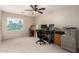 A bedroom with two desks, a ceiling fan, and a printer at 3603 E Indigo Bay Ct, Gilbert, AZ 85234