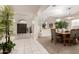 Inviting foyer leading to the dining area, featuring tile flooring and elegant wood doors at 3603 E Indigo Bay Ct, Gilbert, AZ 85234