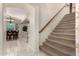 Hallway with tile flooring leading to staircase and dining room area at 3603 E Indigo Bay Ct, Gilbert, AZ 85234