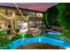 Backyard pool and hot tub with outdoor lighting at 3603 E Indigo Bay Ct, Gilbert, AZ 85234