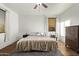 Bright bedroom with wood-look floors, blinds, and ceiling fan at 38208 N La Grange Ln, San Tan Valley, AZ 85140