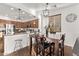 Bright dining area showcasing a breakfast bar that transitions into the kitchen at 38208 N La Grange Ln, San Tan Valley, AZ 85140