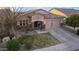 Charming single-story home with manicured front lawn and inviting curb appeal at 38208 N La Grange Ln, San Tan Valley, AZ 85140