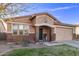 Charming single-story home featuring a unique facade, brick detailing, and a welcoming entryway at 38208 N La Grange Ln, San Tan Valley, AZ 85140