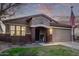 Attractive single-story home featuring an arched entryway, brick pillars, and a welcoming front door at 38208 N La Grange Ln, San Tan Valley, AZ 85140