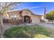 Attractive single-story home with a well-kept lawn, brick accents, and a two-car garage at 38208 N La Grange Ln, San Tan Valley, AZ 85140