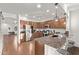 Bright kitchen features granite countertops, stainless steel appliances, and rich wood cabinetry at 38208 N La Grange Ln, San Tan Valley, AZ 85140