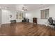 Open living room with a sliding barn door, neutral walls, and a ceiling fan at 38208 N La Grange Ln, San Tan Valley, AZ 85140