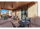 Outdoor patio with ceiling fan, dining table, sliding glass door into the home, and grill at 38208 N La Grange Ln, San Tan Valley, AZ 85140