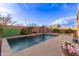 An inviting pool with a poolside gazebo, surrounded by a concrete patio and lush desert landscaping at 38208 N La Grange Ln, San Tan Valley, AZ 85140