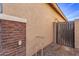 Exterior side yard showing a gate and stucco exterior at 38208 N La Grange Ln, San Tan Valley, AZ 85140