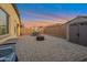 Wide backyard with a large paved patio with outdoor seating and a storage shed at 4143 E Appaloosa Rd, Gilbert, AZ 85296