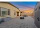 Spacious backyard patio featuring pavers, fire pit, and seating area, perfect for outdoor entertaining at 4143 E Appaloosa Rd, Gilbert, AZ 85296