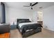 Bedroom with a large bed, dark furniture, and a view into the en-suite bathroom at 4143 E Appaloosa Rd, Gilbert, AZ 85296