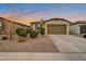 Charming single-story home featuring a two-car garage, well-maintained landscaping, and a welcoming facade at 4143 E Appaloosa Rd, Gilbert, AZ 85296