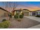 Charming single-story home with manicured front yard and desert landscaping and a two car garage at 4143 E Appaloosa Rd, Gilbert, AZ 85296