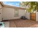 A low maintenance gravel yard featuring a wooden gate, an AC unit, and a walkway at 4226 E Spawn Ln, Gilbert, AZ 85296