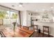 Open dining area with a rustic wooden table and a view of the backyard through sliding glass doors at 4226 E Spawn Ln, Gilbert, AZ 85296