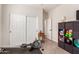 Home exercise room featuring equipment, a window for natural light, and sliding closet doors for storage at 4226 E Spawn Ln, Gilbert, AZ 85296