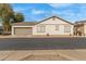 Charming single-story home featuring a two-car garage and neutral-toned stucco exterior at 4226 E Spawn Ln, Gilbert, AZ 85296