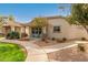 Inviting single-story home with well-manicured lawn, walkway, and covered porch at 4226 E Spawn Ln, Gilbert, AZ 85296