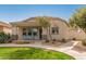 Inviting single-story home with well-manicured lawn, walkway, and covered porch at 4226 E Spawn Ln, Gilbert, AZ 85296