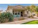 Inviting front porch with chairs and desert landscaping, creating a welcoming entry to the home at 4226 E Spawn Ln, Gilbert, AZ 85296