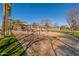 Community playground with swings, shade structure and play area at 4226 E Spawn Ln, Gilbert, AZ 85296