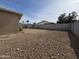 The backyard features desert landscaping and a block wall at 4601 E Pollack Ln, Phoenix, AZ 85042