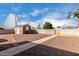 Large backyard featuring a shed, a block wall and rock landscaping at 4626 W Mitchell Dr, Phoenix, AZ 85031