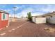 Spacious backyard featuring gravel, a small shed, and a concrete-block perimeter wall at 4626 W Mitchell Dr, Phoenix, AZ 85031