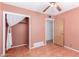 Bedroom with tile floors, closet, ceiling fan and adjacent room at 4626 W Mitchell Dr, Phoenix, AZ 85031